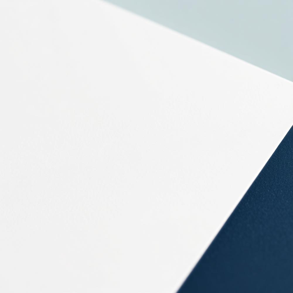 Close detail of Miracle Everyday paper stock meeting a navy edge